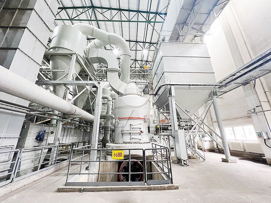 Technician performing preventive maintenance on grinding mill