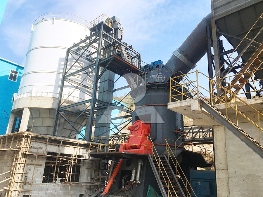 Technicians performing maintenance on a large coal grinding mill