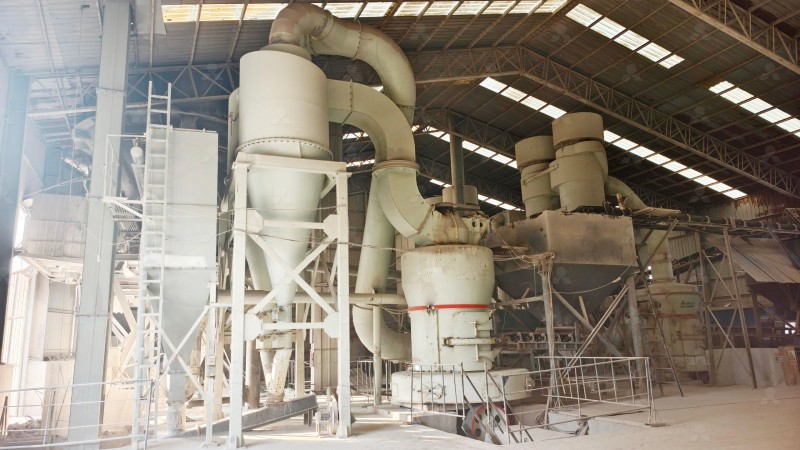 Industrial gypsum processing plant in Indonesia showing conveyor belts and large milling equipment