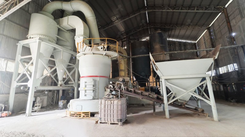 Industrial limestone grinding mill in operation at a quarry site