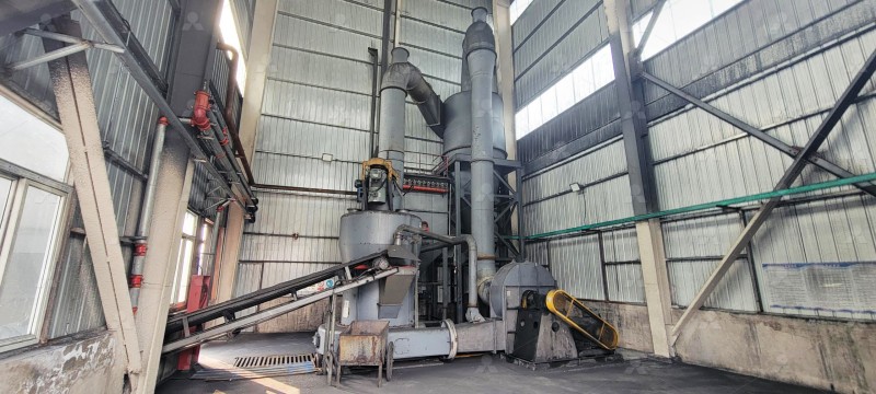 Interior view of a hammer mill crusher showing hammers and grinding chamber