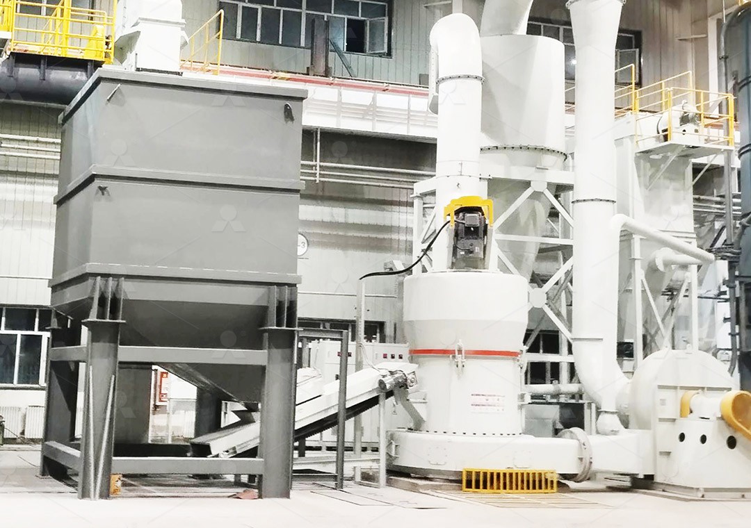 Industrial hammer mill in operation processing mineral materials