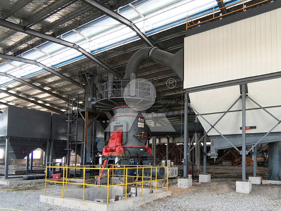 Modern vertical grinding mill in industrial setting