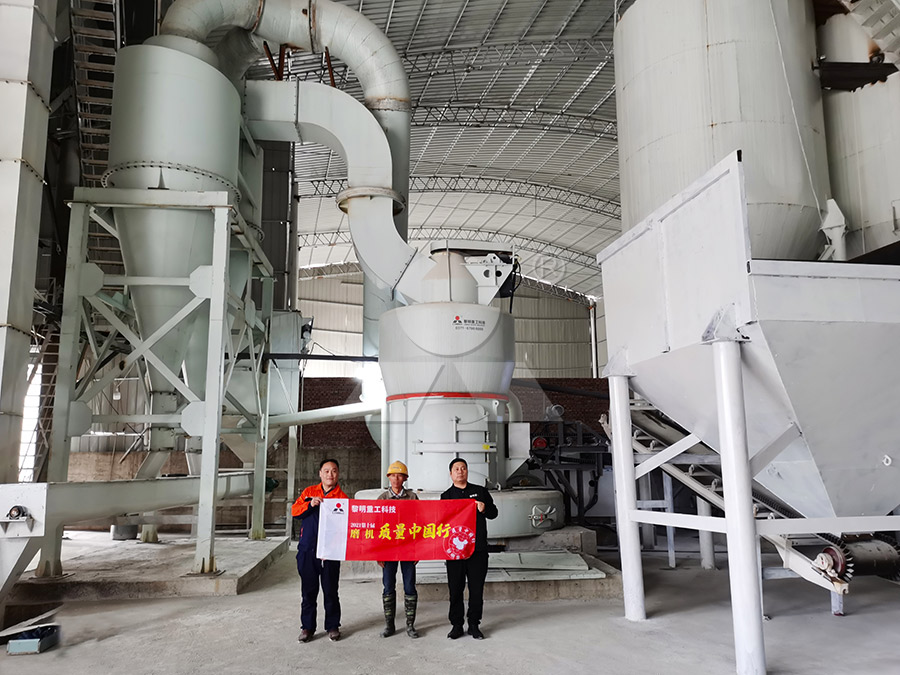 Aerial view of a calcium carbonate grinding plant with silos and conveyor systems