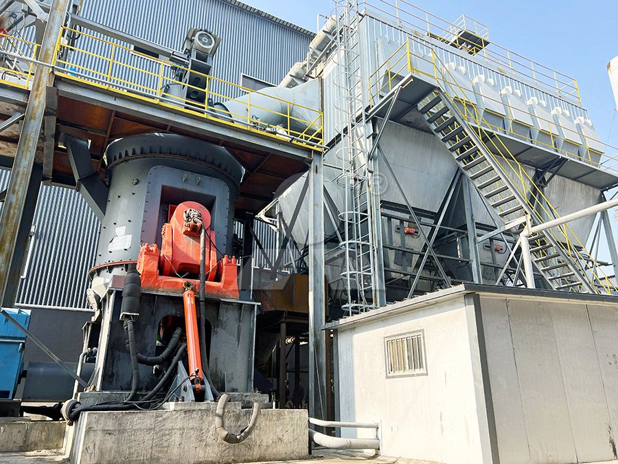 Close-up of a vertical grinding mill roller assembly in a factory setting